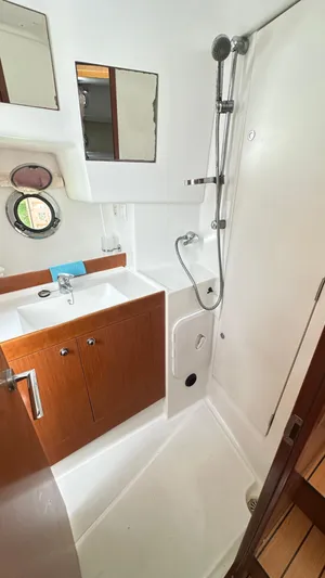  Yacht Photos Pics Bathroom interior of 2009 Beneteau Swift Trawler 34 with shower and sink.