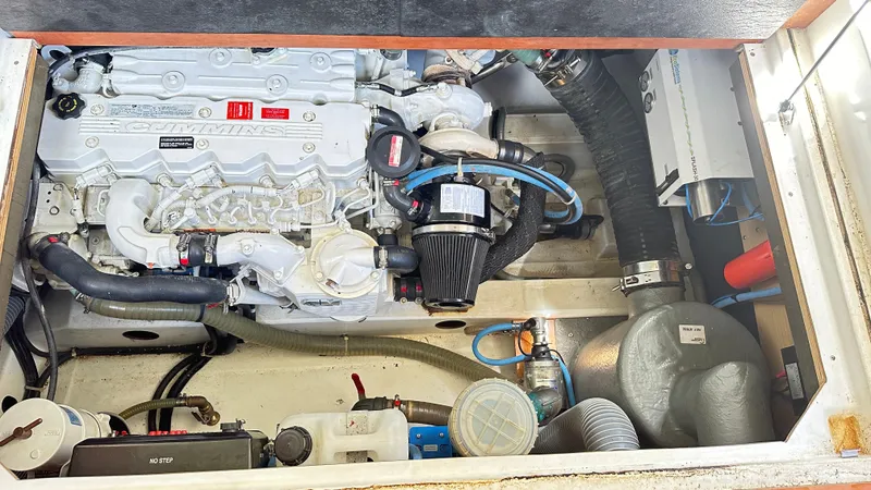  Yacht Photos Pics Engine compartment of a 2009 Beneteau Swift Trawler 34, showcasing mechanical components and systems.
