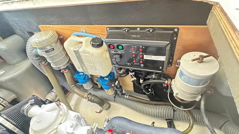  Yacht Photos Pics Engine compartment of a 2009 Beneteau Swift Trawler 34, showcasing control panel and components.