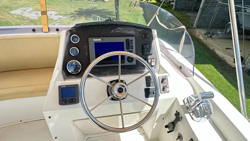  Yacht Photos Pics 2009 Beneteau Swift Trawler 34 helm with steering wheel and navigation instruments.