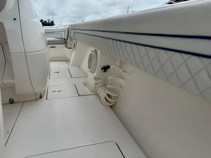  Yacht Photos Pics 2018 Intrepid 327 Center Console boat interior with white seating and speaker.