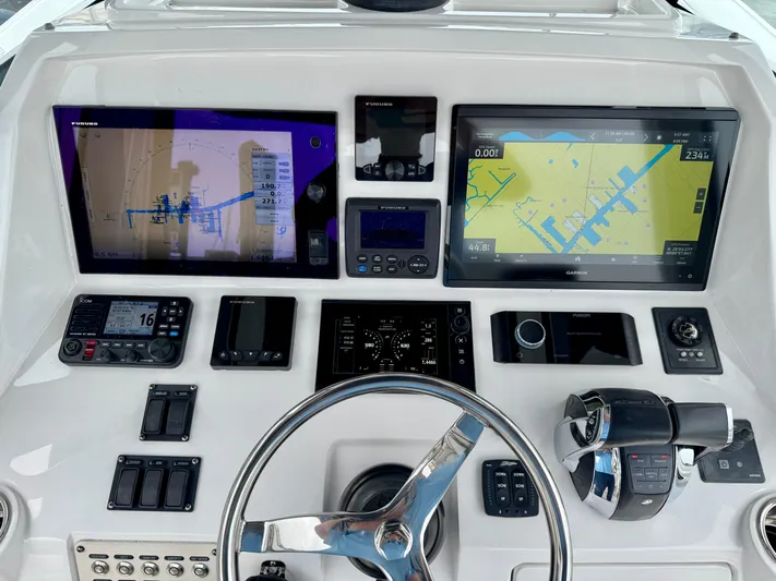  Yacht Photos Pics 2018 Intrepid 327 Center Console dashboard with navigation screens and controls.
