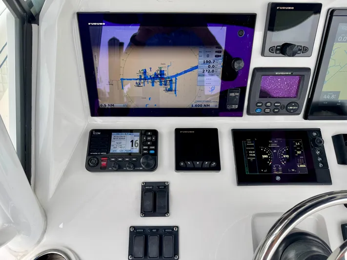  Yacht Photos Pics Control panel of a 2018 Intrepid 327 Center Console with navigation and communication systems.