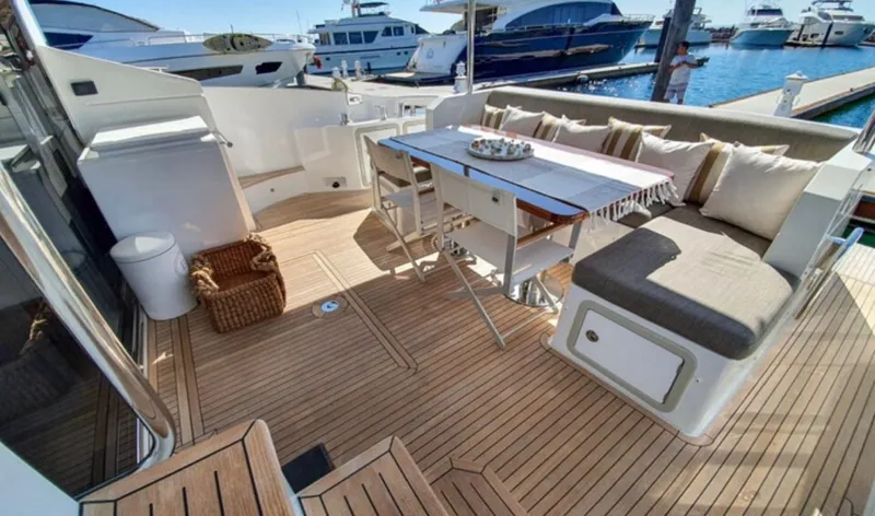 Mi Bluu Yacht Photos Pics Luxurious 2019 Azimut Flybridge 66 yacht deck with seating and dining area.