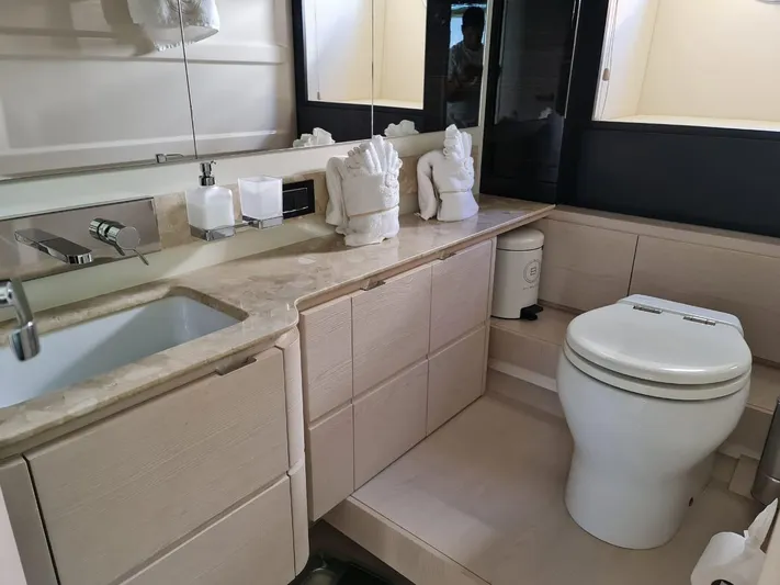 Mi Bluu Yacht Photos Pics Luxurious bathroom in 2019 Azimut Flybridge 66 yacht with modern fixtures and elegant design.