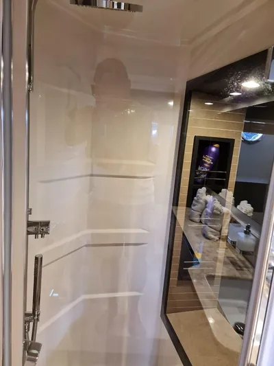 Mi Bluu Yacht Photos Pics Luxurious bathroom interior of 2019 Azimut Flybridge 66 yacht, featuring modern shower design.