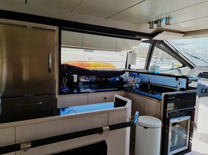 Mi Bluu Yacht Photos Pics Interior of 2019 Azimut Flybridge 66 yacht kitchen with modern appliances and sleek design.