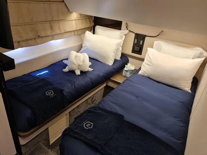Mi Bluu Yacht Photos Pics Luxurious twin cabin in 2019 Azimut Flybridge 66 yacht with elegant bedding and decor.