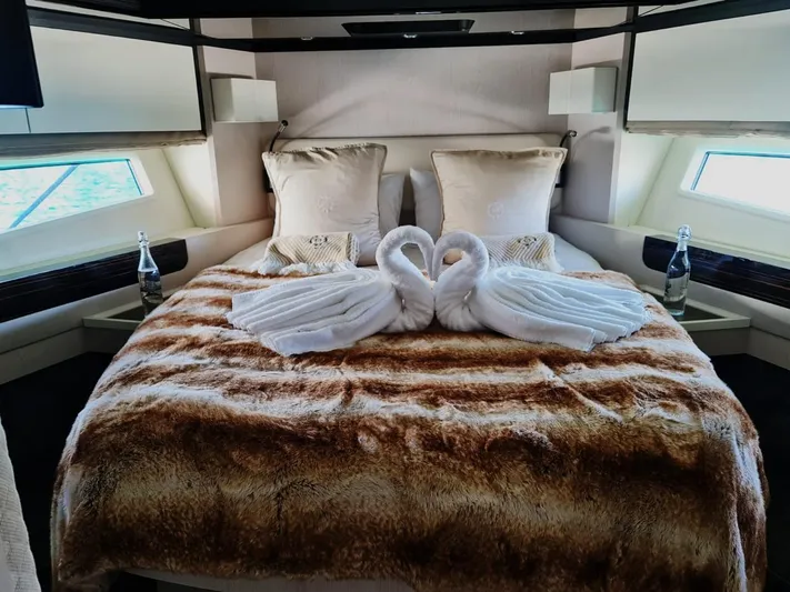 Mi Bluu Yacht Photos Pics Luxurious bedroom in 2019 Azimut Flybridge 66 yacht with elegant swan towel decor.