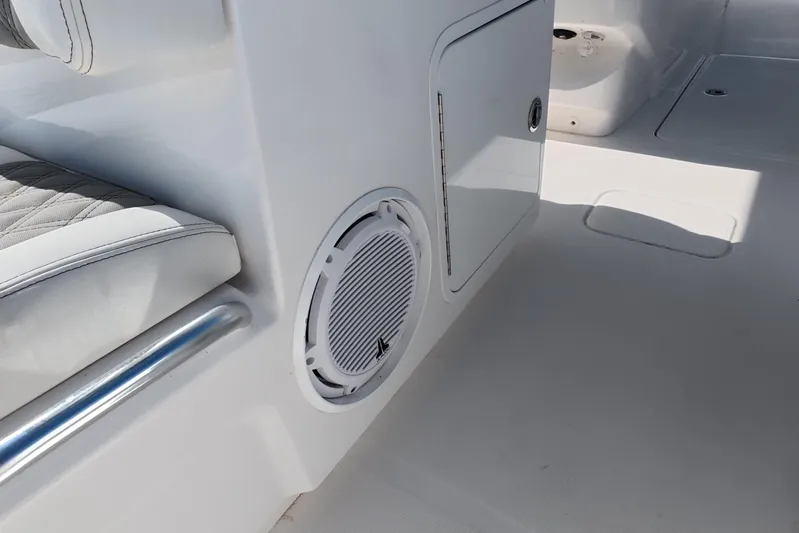  Yacht Photos Pics 2023 Invincible 33 Catamaran interior with speaker and cushioned seating detail.