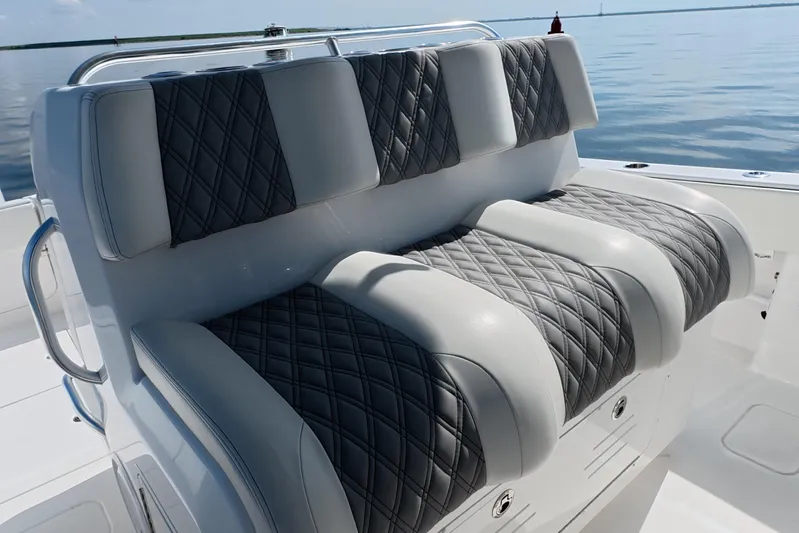  Yacht Photos Pics Luxurious seating on 2023 Invincible 33 Catamaran, featuring diamond-stitched upholstery.