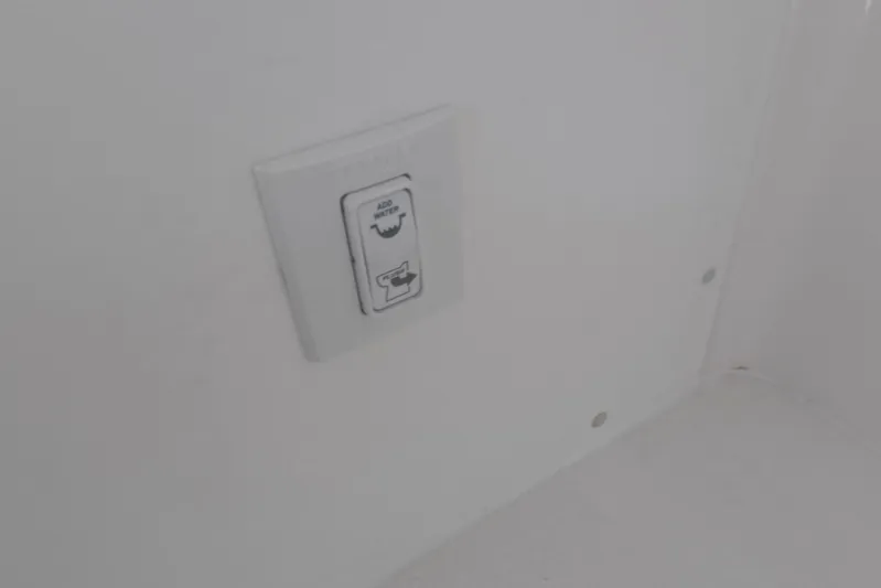  Yacht Photos Pics Switch panel on 2023 Invincible 33 Catamaran interior, labeled "Add Water."