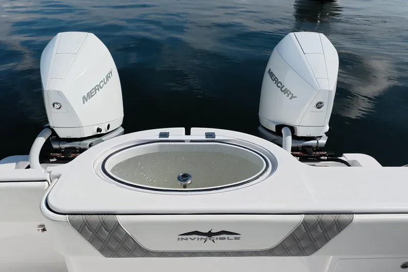  Yacht Photos Pics 2023 Invincible 33 Catamaran with dual Mercury engines on calm water.