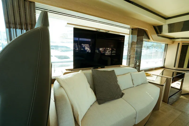  Yacht Photos Pics Luxurious interior of 2024 Absolute NAVETTA 52 yacht with modern sofa and large windows.