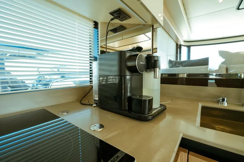  Yacht Photos Pics Luxury yacht kitchen with coffee machine, Absolute NAVETTA 52, 2024 model.