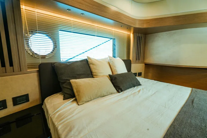  Yacht Photos Pics Luxurious bedroom interior of 2024 Absolute NAVETTA 52 yacht with modern design.