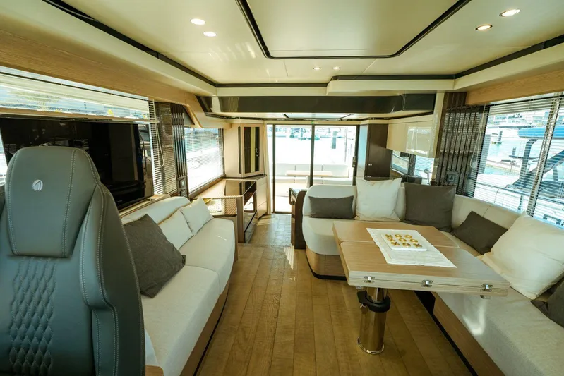  Yacht Photos Pics Luxurious interior of 2024 Absolute NAVETTA 52 yacht with modern seating and elegant design.