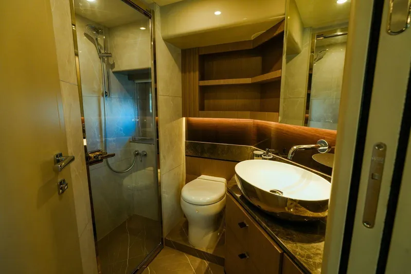  Yacht Photos Pics Luxurious bathroom in 2024 Absolute NAVETTA 52 yacht with modern fixtures and elegant design.