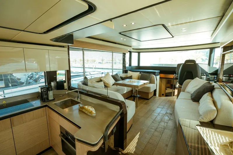  Yacht Photos Pics Luxurious interior of 2024 Absolute NAVETTA 52 yacht with modern kitchen and seating area.