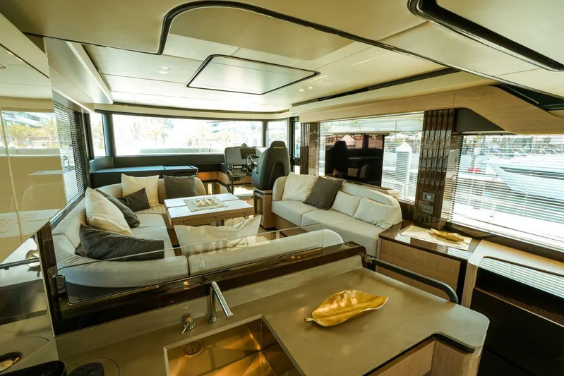  Yacht Photos Pics Luxurious interior of 2024 Absolute NAVETTA 52 yacht with modern furnishings and panoramic windows.