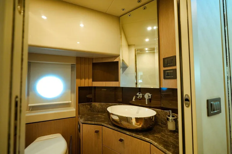  Yacht Photos Pics Luxurious bathroom interior of 2024 Absolute NAVETTA 52 yacht with modern fixtures and elegant design.