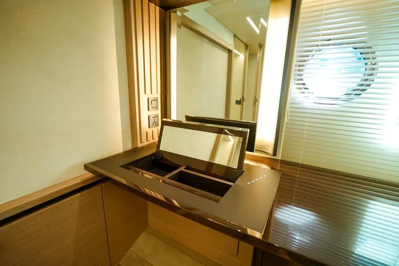  Yacht Photos Pics Luxurious interior of 2024 Absolute NAVETTA 52 yacht with modern vanity and mirror.