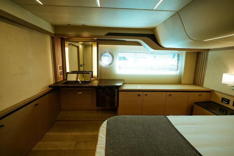  Yacht Photos Pics Luxurious interior of 2024 Absolute NAVETTA 52 yacht with modern furnishings and ambient lighting.