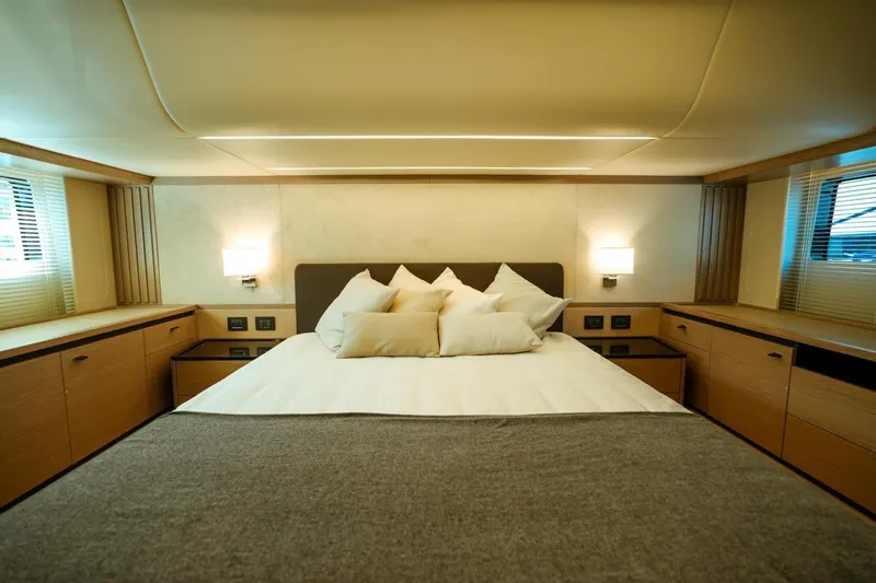  Yacht Photos Pics Luxurious bedroom interior of 2024 Absolute NAVETTA 52 yacht with modern design.