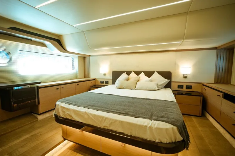  Yacht Photos Pics Luxurious bedroom interior of 2024 Absolute NAVETTA 52 yacht with modern design and cozy ambiance.