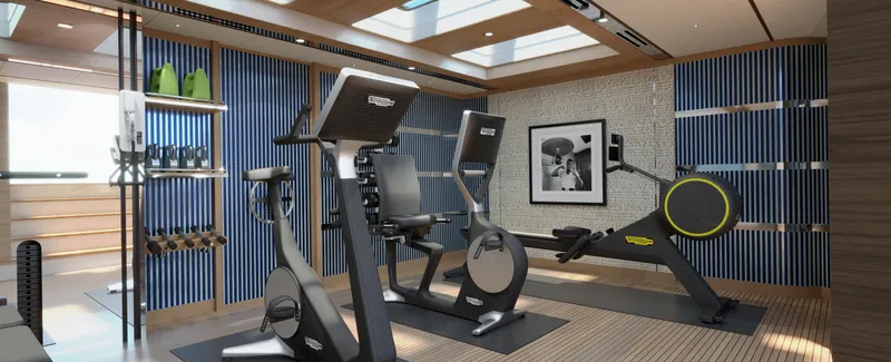 Spitfire Yacht Photos Pics Modern gym with exercise bikes, rowing machine, and sleek design, featuring ARES SPITFIRE 2027 equipment.