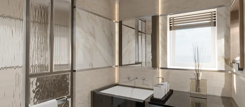 Spitfire Yacht Photos Pics Luxurious modern bathroom with marble walls, large mirror, and natural light from window.