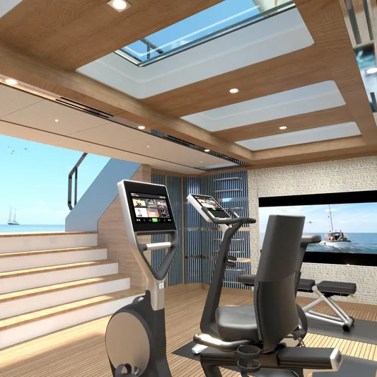 Spitfire Yacht Photos Pics Luxurious yacht gym with modern equipment, skylight, and ocean view, 2027 ARES SPITFIRE.