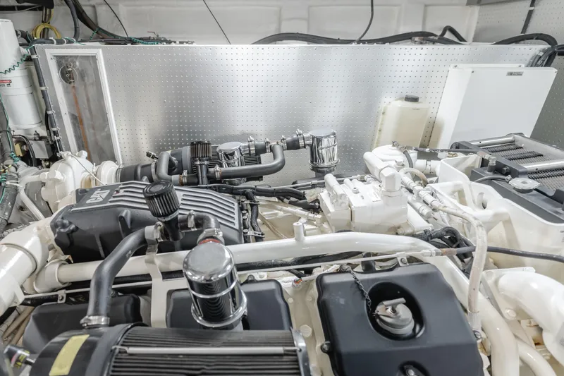 Money Cat Yacht Photos Pics Engine room of a 2003 TransWorld CUSTOM boat with visible components and wiring.