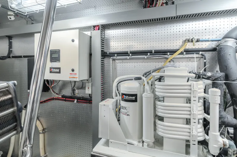 Money Cat Yacht Photos Pics TransWorld CUSTOM 2003 engine room with electrical panel and machinery.