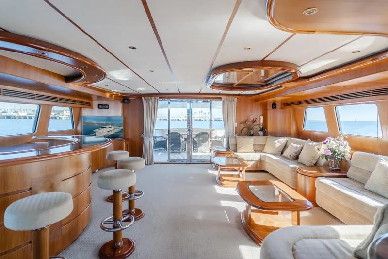 Money Cat Yacht Photos Pics Luxurious 2003 TransWorld CUSTOM yacht interior with elegant seating, bar stools, and panoramic windows.