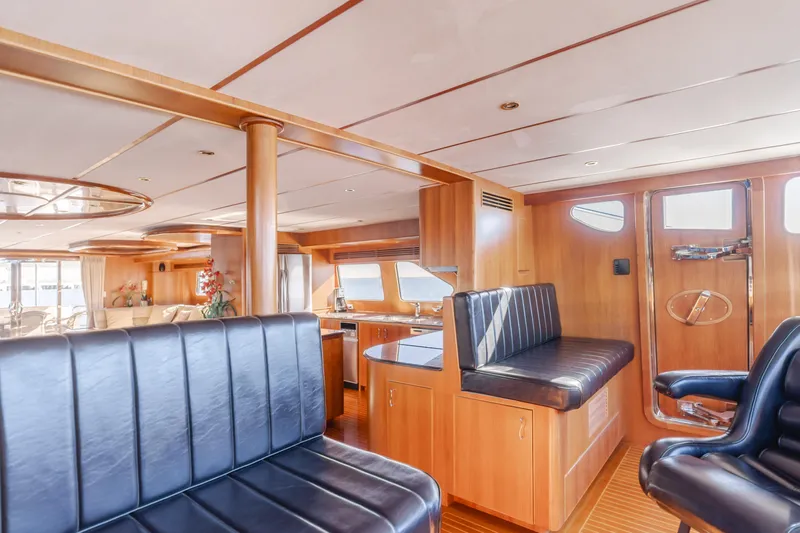 Money Cat Yacht Photos Pics Luxurious 2003 TransWorld CUSTOM yacht interior with wood paneling and leather seating.