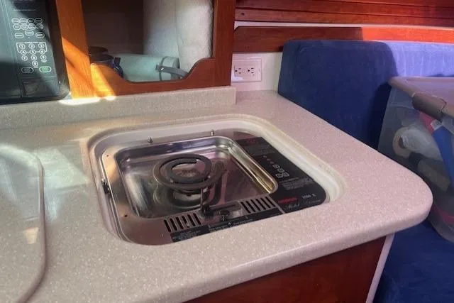  Yacht Photos Pics 2008 Back Cove 29 boat interior with stove and countertop in cabin.