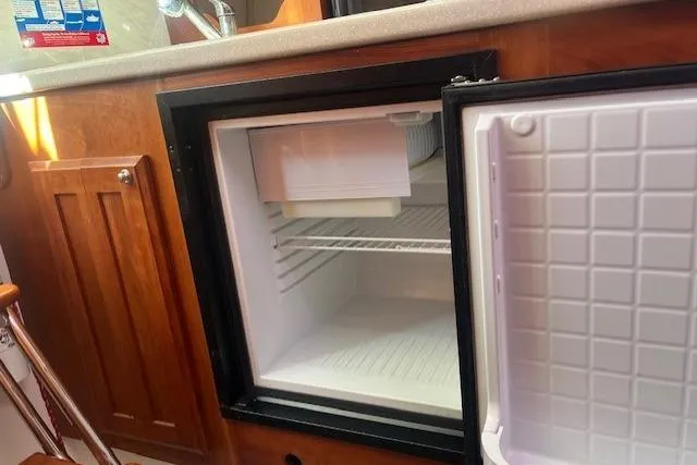  Yacht Photos Pics Open mini fridge in 2008 Back Cove 29 boat kitchen area.