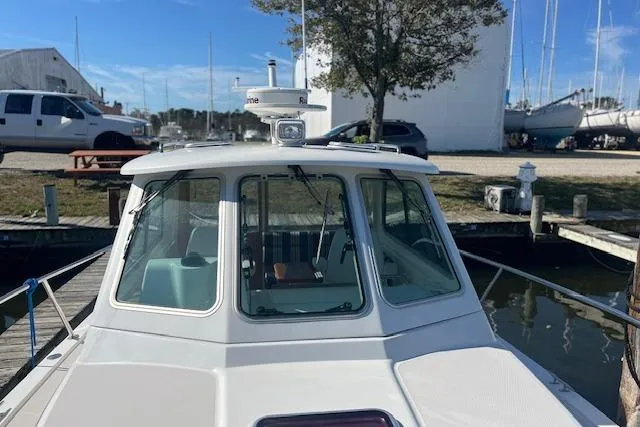  Yacht Photos Pics 2008 Back Cove 29 boat docked, front view with clear windows and radar equipment.