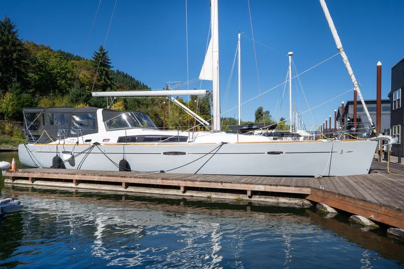 Resiliance Yacht Photos Pics 2013 Beneteau Oceanis 50 sailboat docked at marina, clear blue sky background.