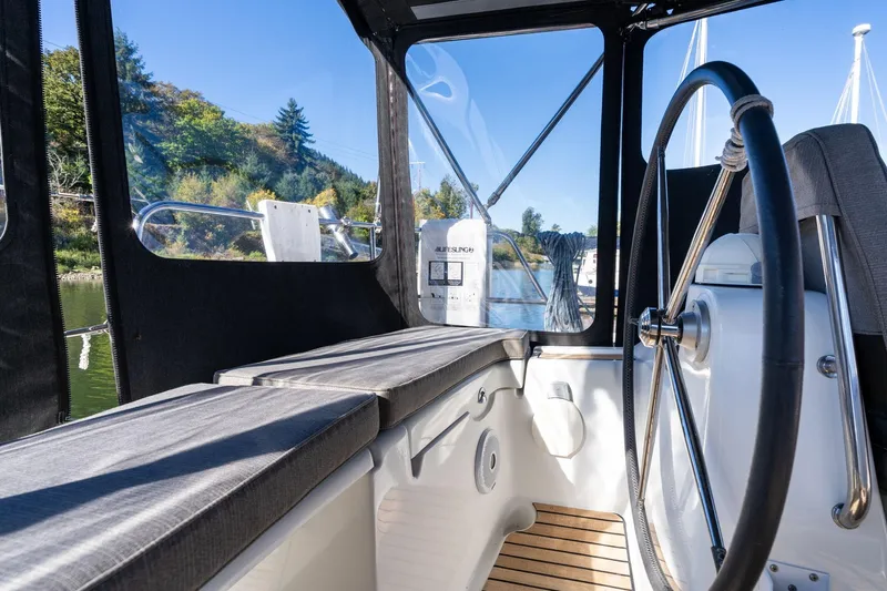 Resiliance Yacht Photos Pics Interior view of 2013 Beneteau Oceanis 50 sailboat cockpit with steering wheel.