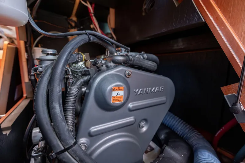 Resiliance Yacht Photos Pics Yanmar engine inside a 2013 Beneteau Oceanis 50 sailboat, showcasing mechanical components.