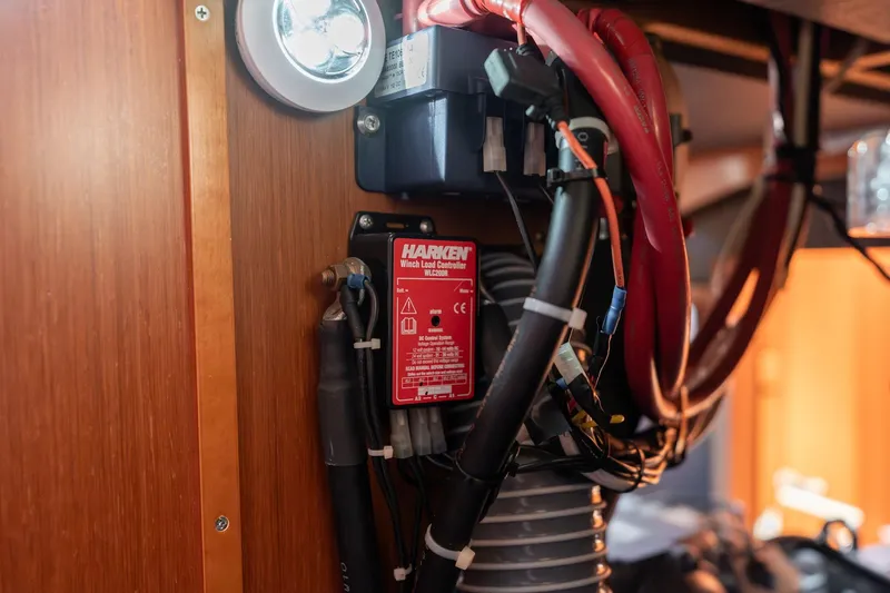 Resiliance Yacht Photos Pics Electrical components inside a 2013 Beneteau Oceanis 50 yacht, featuring Harken winch load controller.