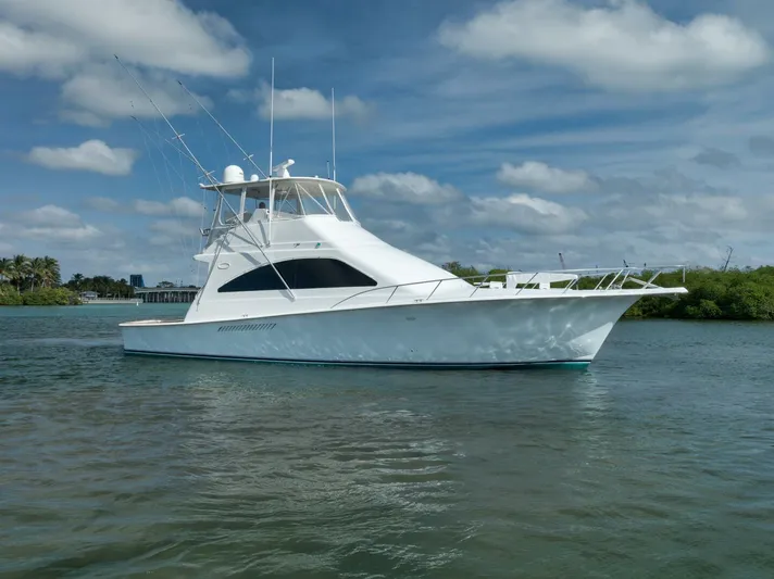 Mullet Yacht Photos Pics 2006 Ocean Yachts 50 Super Sport boat on calm water under a partly cloudy sky.