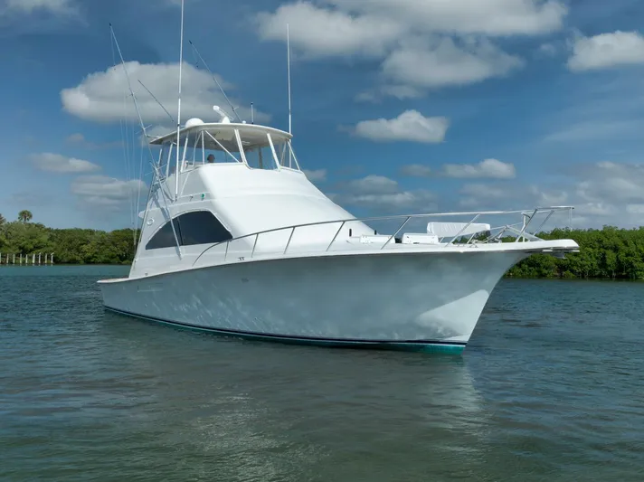 Mullet Yacht Photos Pics 2006 Ocean Yachts 50 Super Sport boat on calm water under blue sky.
