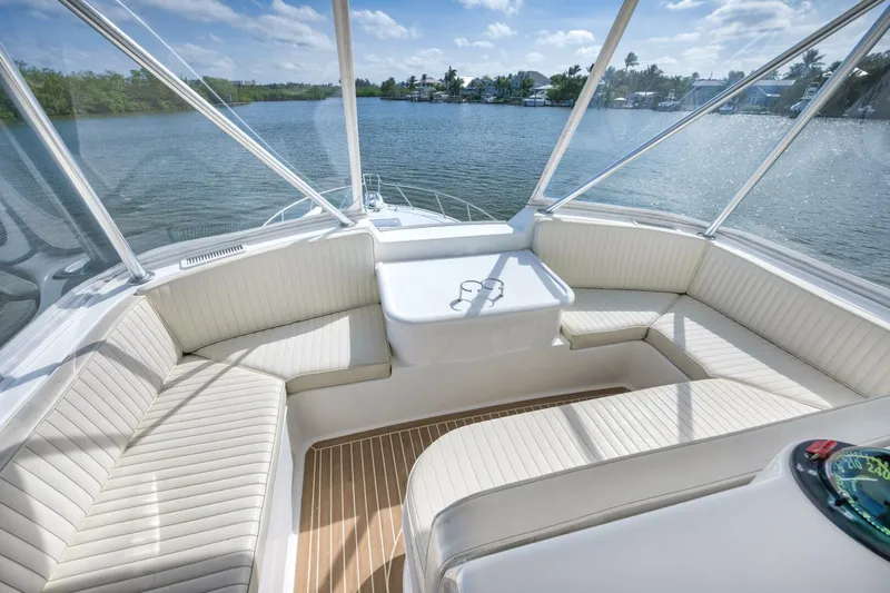 Mullet Yacht Photos Pics 2006 Ocean Yachts 50 Super Sport cockpit with white seating and scenic water view.