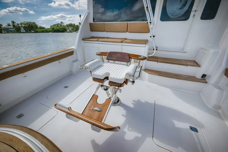 Mullet Yacht Photos Pics 2006 Ocean Yachts 50 Super Sport fishing deck with chair, seating, and water view.