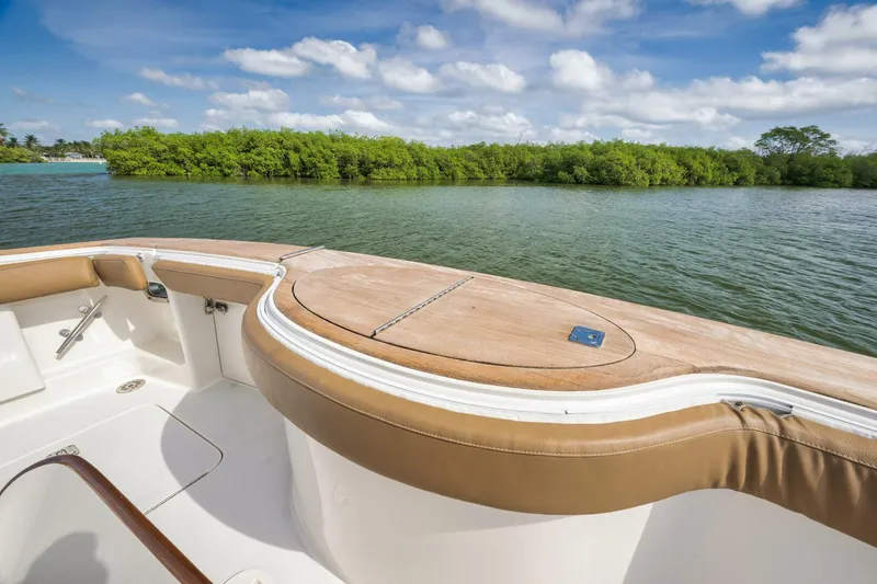 Mullet Yacht Photos Pics 2006 Ocean Yachts 50 Super Sport boat deck with scenic water and greenery view.