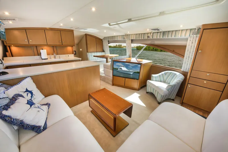 Mullet Yacht Photos Pics Luxurious interior of 2006 Ocean Yachts 50 Super Sport with elegant furnishings and scenic window view.