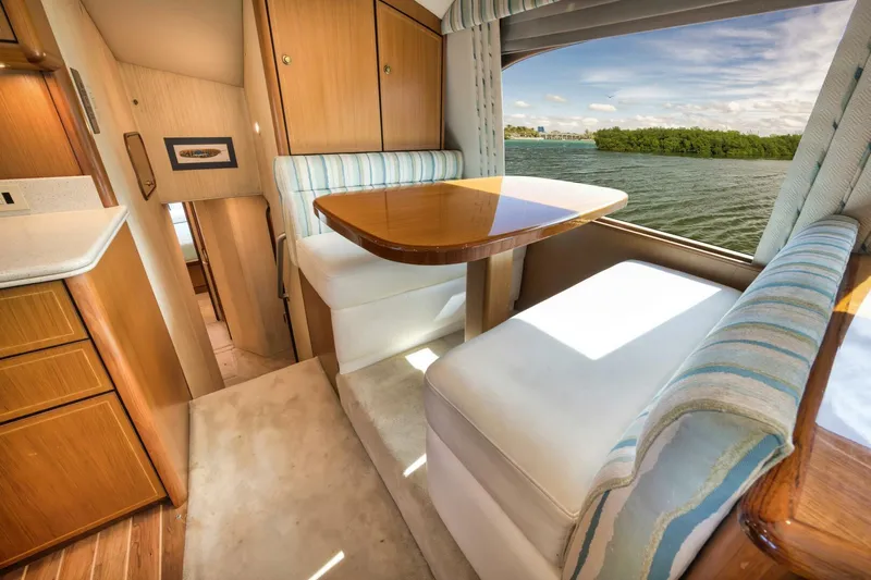 Mullet Yacht Photos Pics Interior of 2006 Ocean Yachts 50 Super Sport with dining area and scenic water view.